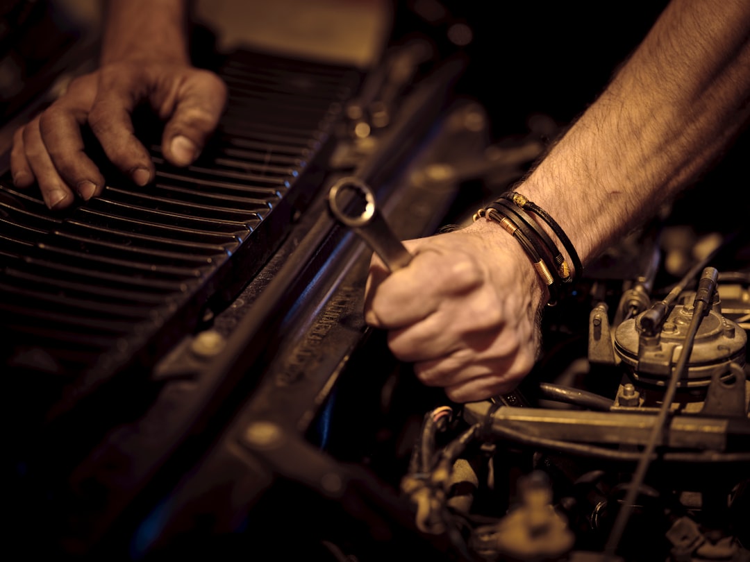 Mechanic running diagnostics on a diesel truck engine in Yuma, AZ